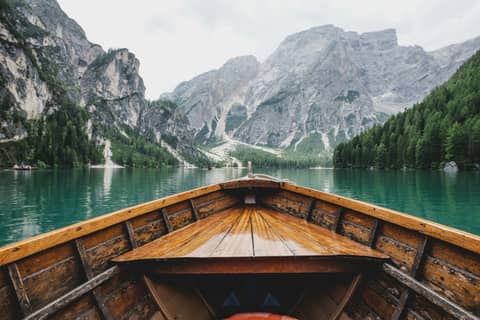 A boat crossing a mountain lake
