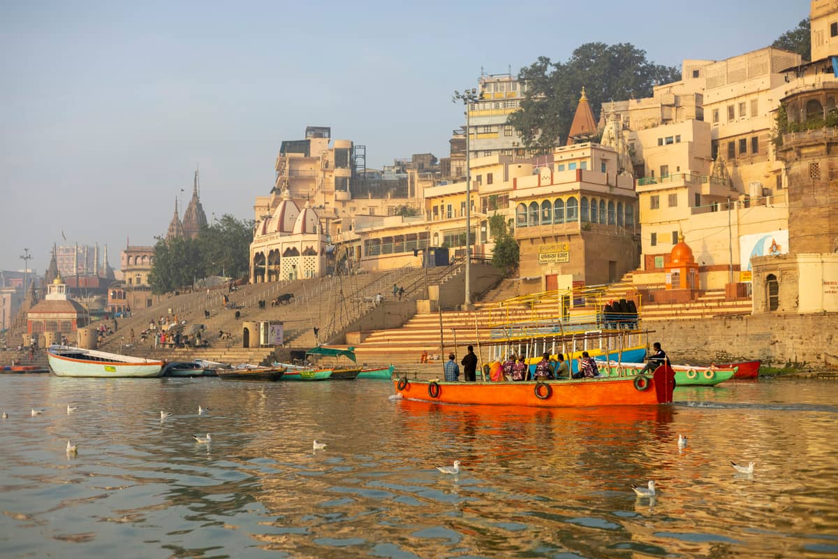Boats along the ghats of Varanasi in golden morning light